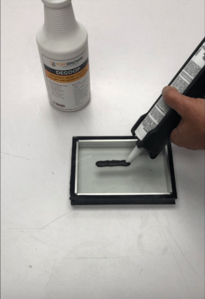 Applying Black Structural Silicone Sealant Pittsburgh | Tom Brown, Inc.